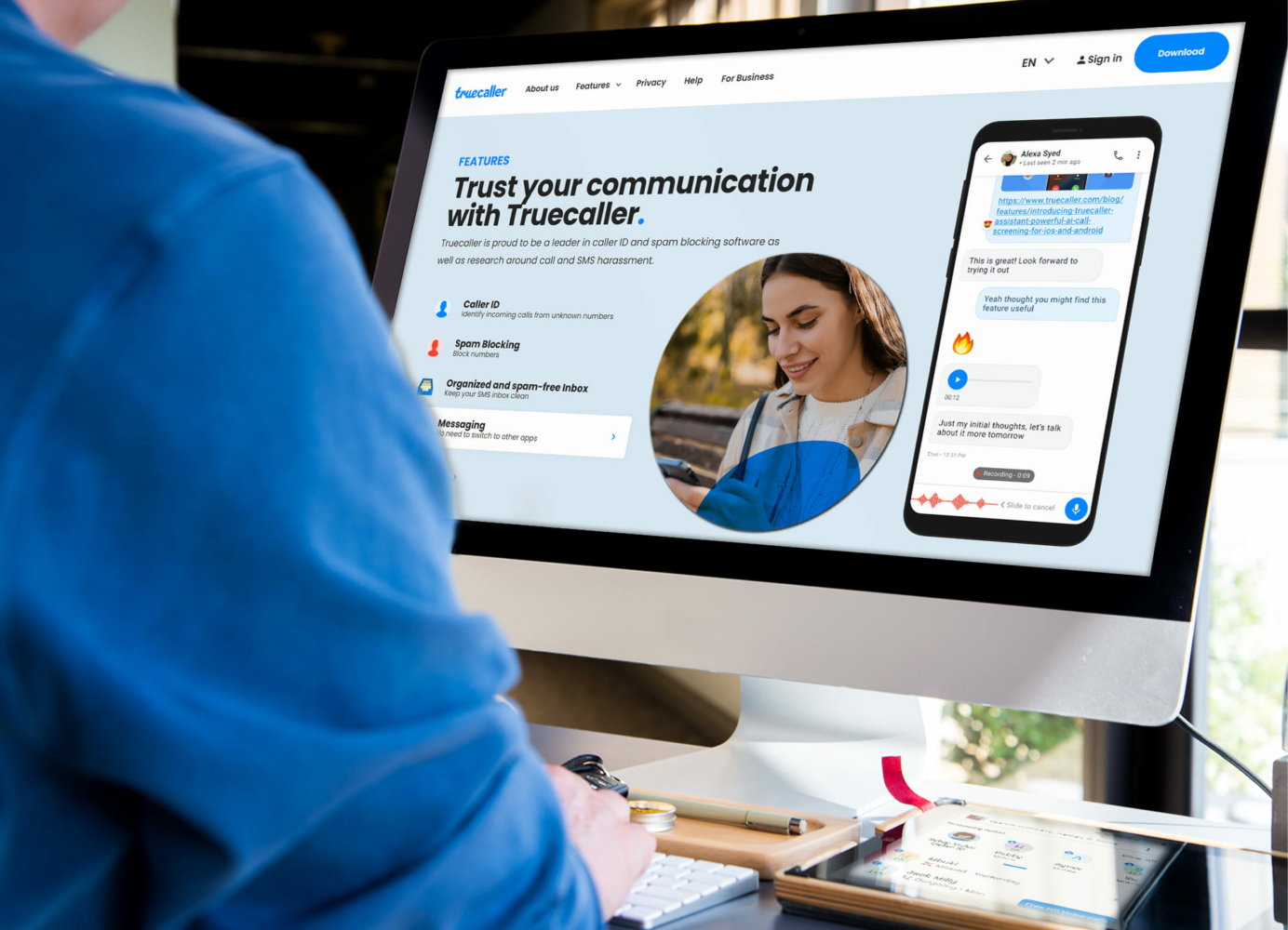 On the computer, the Truecaller website page is open with the functions it provides